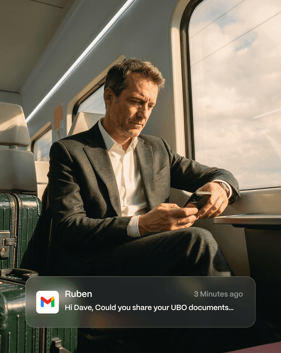 Business professional checking phone on train
